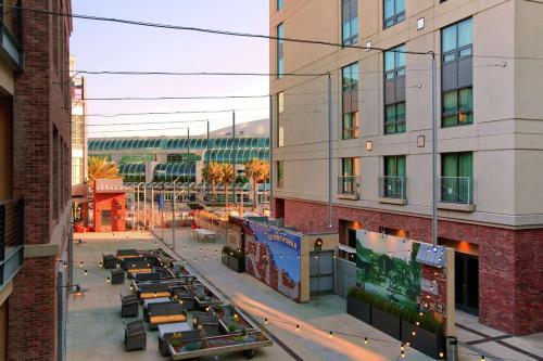 a view of a city street with tables and buildings at Hilton San Diego Gaslamp Quarter in San Diego