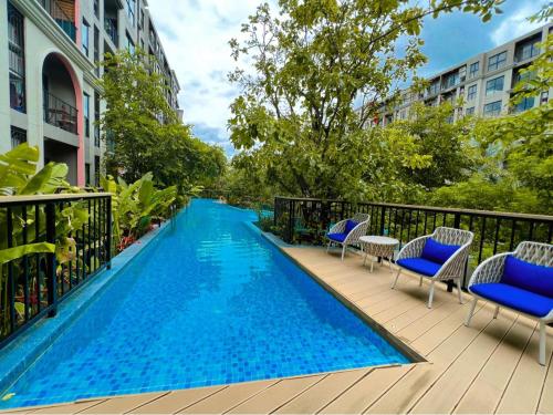 a swimming pool on the balcony of a building at La Habana Huahin by Ying in Hua Hin