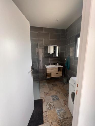 a bathroom with a toilet and a sink at Résidence Mk Evasion in Jonzac