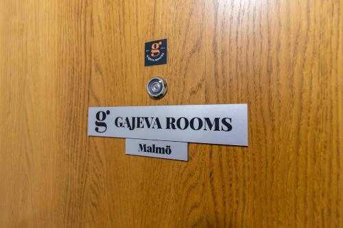 a door with a sign that says geviva rooms gmaxwell at Gajeva Rooms - Malmö apartment SELF CHECK-IN in Virovitica
