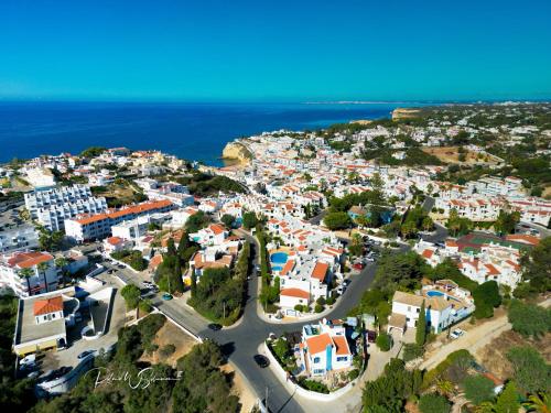 an aerial view of a town with the ocean at Villa Welwitshia in Carvoeiro