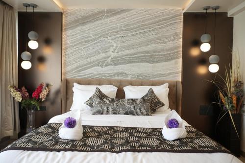 Кровать или кровати в номере Hotel City Symphony