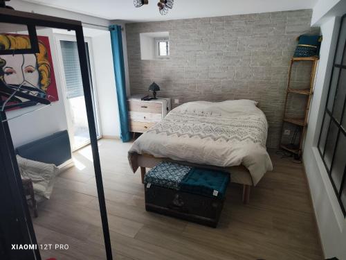 Postel nebo postele na pokoji v ubytování Appartement rénovée dans maison ancienne