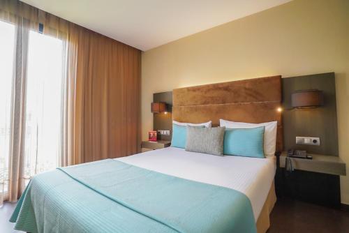 Katil atau katil-katil dalam bilik di Hotel Constanza