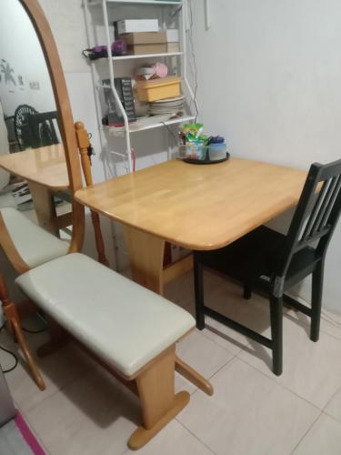 a wooden table with two chairs and a mirror at homesweethome 
