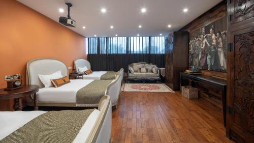 a hotel room with four beds and a piano at Hotel Cote Cour Deductive Beijing - Quadrangle close to Tiananmen Square & Forbidden City & Nanluoguxiang, Walk to Wangfujing, English speaking, Free WiFi, Free Laundry, Free Wonton & Noodles with Tour ticket service, Free selfies with ancient costume in Beijing