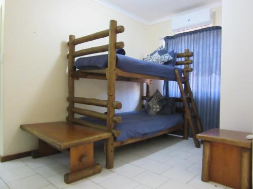 a bedroom with two bunk beds in a room at Luwandla 12 in St Lucia