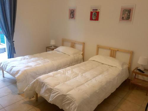 Letto o letti in una camera di Affittacamere Italia Leonardo
