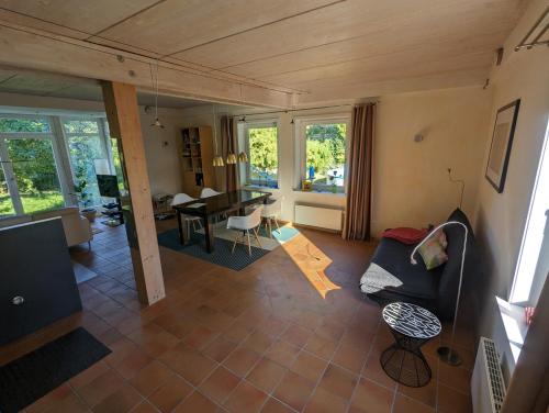 a living room with a couch and a table at "Buena Vista" Ashausen/Hamburg in Stelle