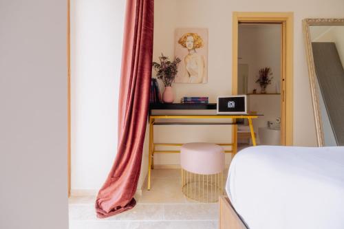 Ένα ή περισσότερα κρεβάτια σε δωμάτιο στο Casa Eleonora, balcone con vista e colazione