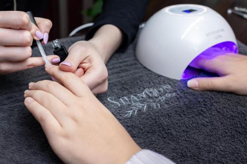 a person getting their nails done at a nail salon at Shandon Lodge Guest House & Spa in Nelspruit