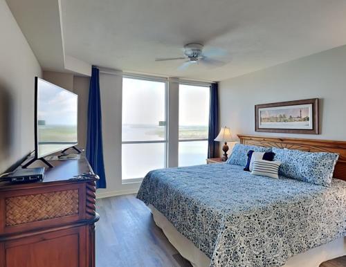a bedroom with a bed and a large window at Lovers Key Resort 1105 - 1 Bedroom - Sleeps 4 in Fort Myers Beach