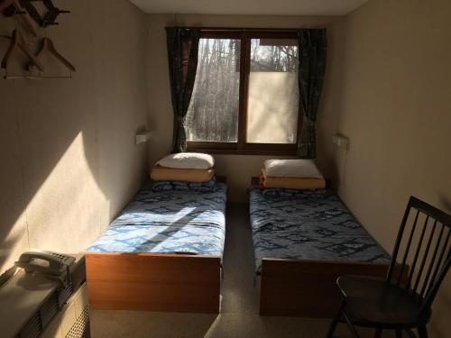 a small room with two beds and a window at New Togakushi Sea Hail - Vacation STAY 61014v in Nagano