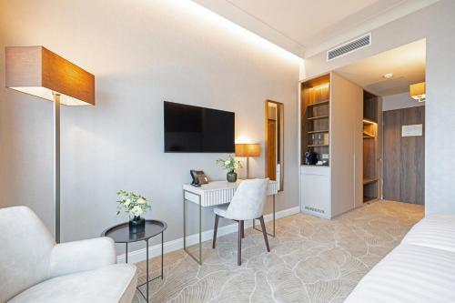 TV a/nebo společenská místnost v ubytování Hotel Gerardus