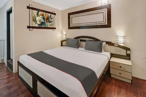 a bedroom with a large bed in a room at Sabharwal Residency Near Lalbagh Botanical Garden in Bangalore