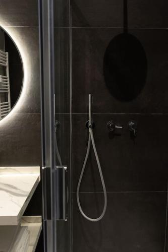 a shower with a shower head in a bathroom at Spazio SIMA Space 2 - 2 in Milan