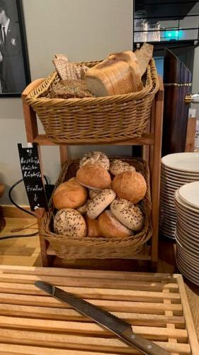 a basket of bread and a basket of bread at Nybro Stora Hotellet in Nybro