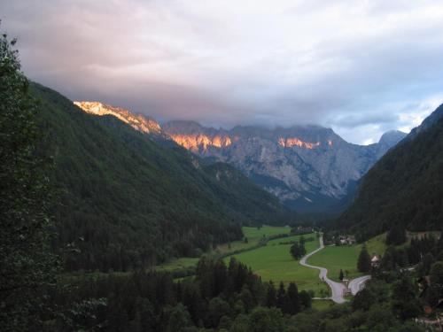 a view of a valley with mountains in the background at Guest House and Museum Firšt in Solčava