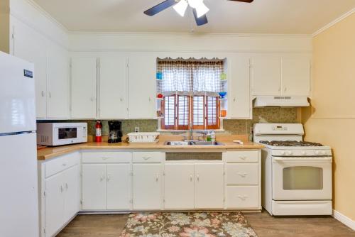 a kitchen with white cabinets and a white stove top oven at about 8 Mi From Canalside! Buffalo Vacation Rental in Buffalo