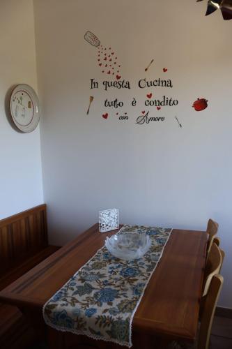 a table in a room with a plate on it at B&b Mamì in Potenza