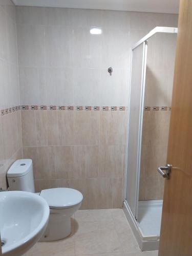 a bathroom with a toilet and a sink and a shower at La Casella playa de Gandia in Playa de Gandia