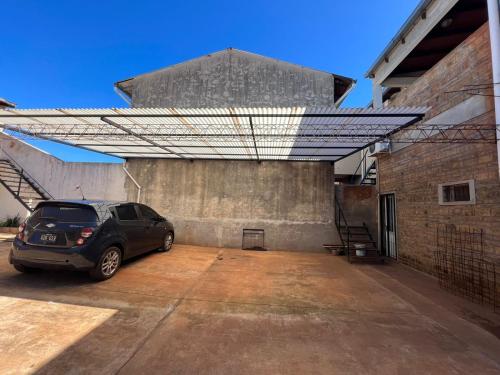 a car parked in a parking lot next to a building at Depto Diario en alquiler. Hasta 5 personas in Apóstoles