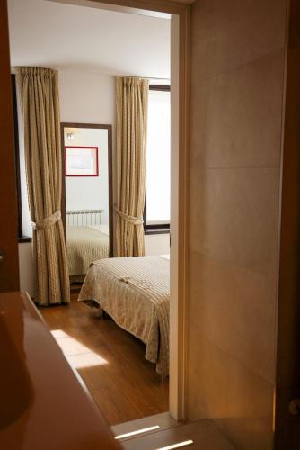 Albergo Antica Locandaにあるベッド