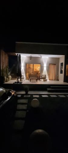 a view of a living room at night at DAR-Layem in Hanshīr Qaşr Ghallāb