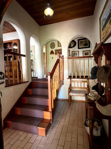 a hallway with a staircase in a house at GUESTHOUSE SHALOM in Springs