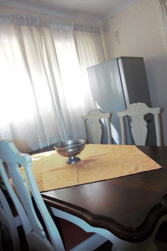 Μια τηλεόραση ή/και κέντρο ψυχαγωγίας στο Accommodation at Potch Guesthouse