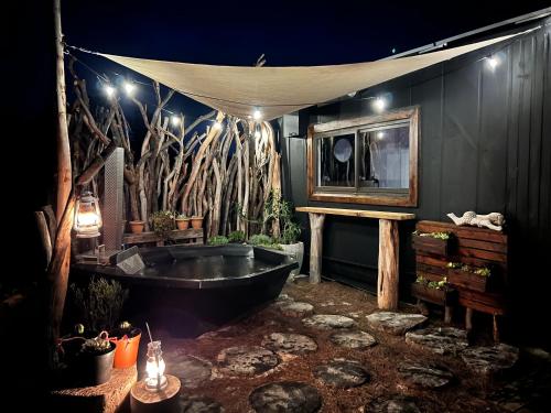 a bathroom with a bath tub and a mirror at Into The Mystic in Cape Town