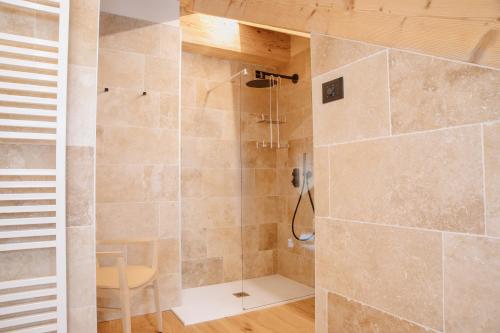 a bathroom with a shower with a glass door at Ca'Lisel in Valdobbiadene