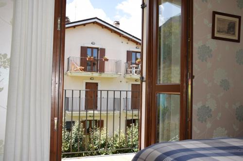 a room with a window with a view of a building at Casa Palmira in Pescocostanzo