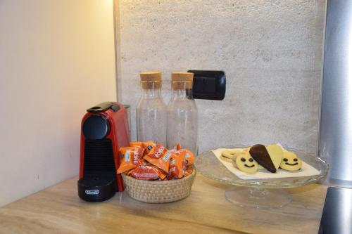 a counter with two bottles and a plate of food at Casa Palmira in Pescocostanzo