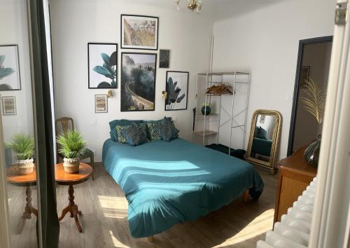 Ένα ή περισσότερα κρεβάτια σε δωμάτιο στο Appartement chaleureux
