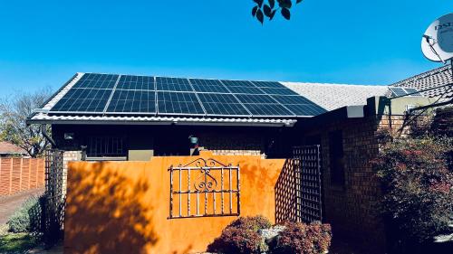 a house with solar panels on the roof at Revenir in Middelburg