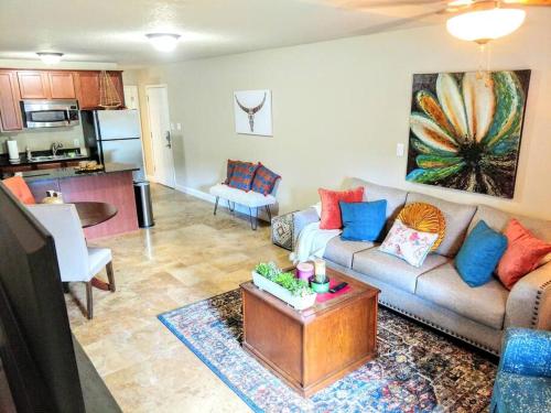 a living room with a couch and a table at Perfect Lake Retreat in Hot Springs