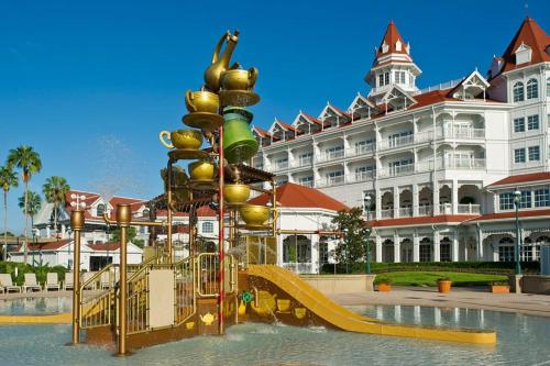 a playground in front of a large building at Disney’s Grand Floridian Resort in Orlando