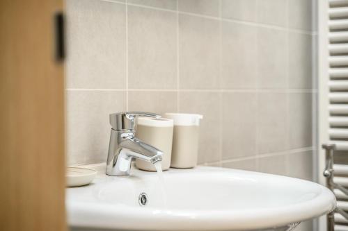 a bathroom sink with a faucet on top of it at T12- Bilocale Free WiFi vicino a Bologna Fiera, Ravenna, Lugo Hospital Villa Maria in SantʼAgata sul Santerno