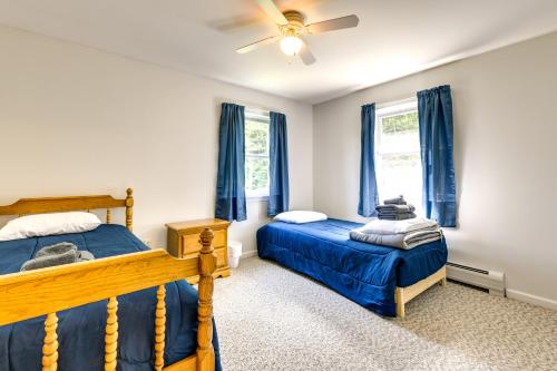 a bedroom with two beds and a ceiling fan at Vermont Vacation Rental about 11 Mi to Lake Willoughby in East Charleston
