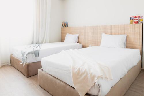 Кровать или кровати в номере Mivida Emaar - Residence by Elegant Hospitality