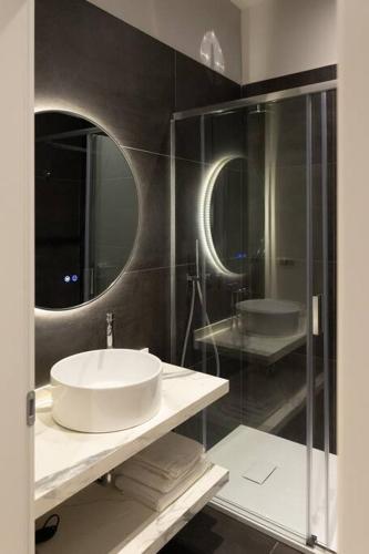 a bathroom with a sink and a mirror at Spazio SIMA Space 2 - 1 in Milan