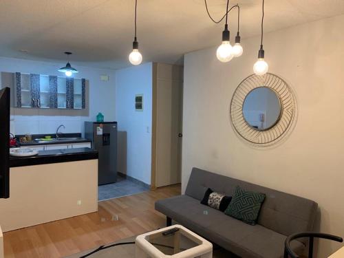 a living room with a couch and a kitchen at 807. Departamento entero en Chorrillos in Lima