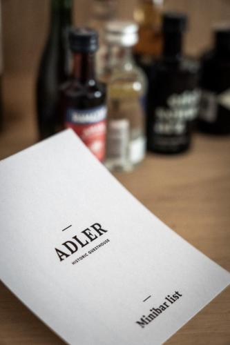 a white envelope sitting on top of a table at ADLER Historic Guesthouse in Bressanone