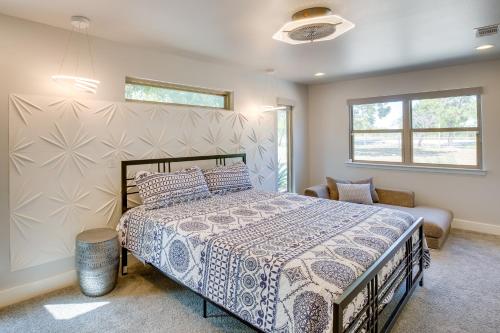 a bedroom with a bed and a window at Patios and Lake View McKinney Ranch Home! in McKinney