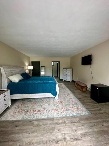 a bedroom with a bed and a flat screen tv at Cozy 1-Bedroom Suite in Sybertsville