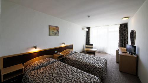 Llit o llits en una habitació de Hotel Shipka