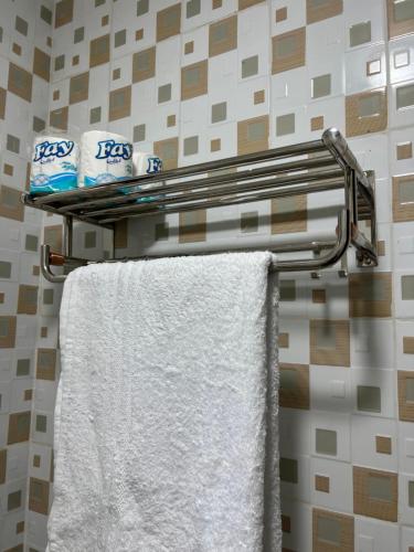 a towel rack with two towels on it in a bathroom at Fivas Residences in Arua