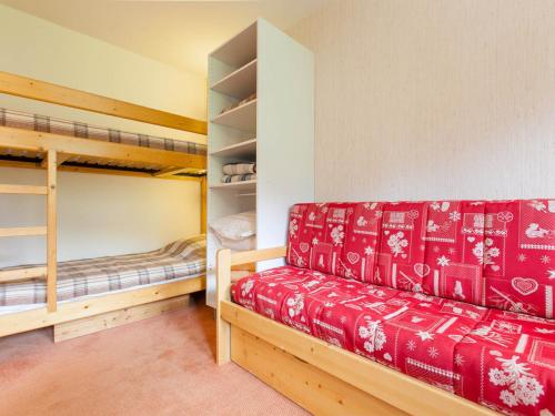 a room with a couch and two bunk beds at Appartement Avoriaz, 2 pièces, 5 personnes - FR-1-314-156 in Morzine