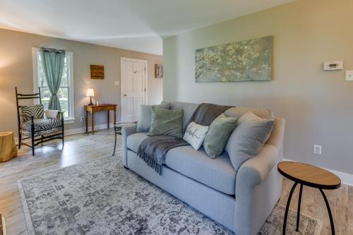 a living room with a couch and a table at Tranquil Cottage in Virginia Countryside with Pond! in Midlothian
